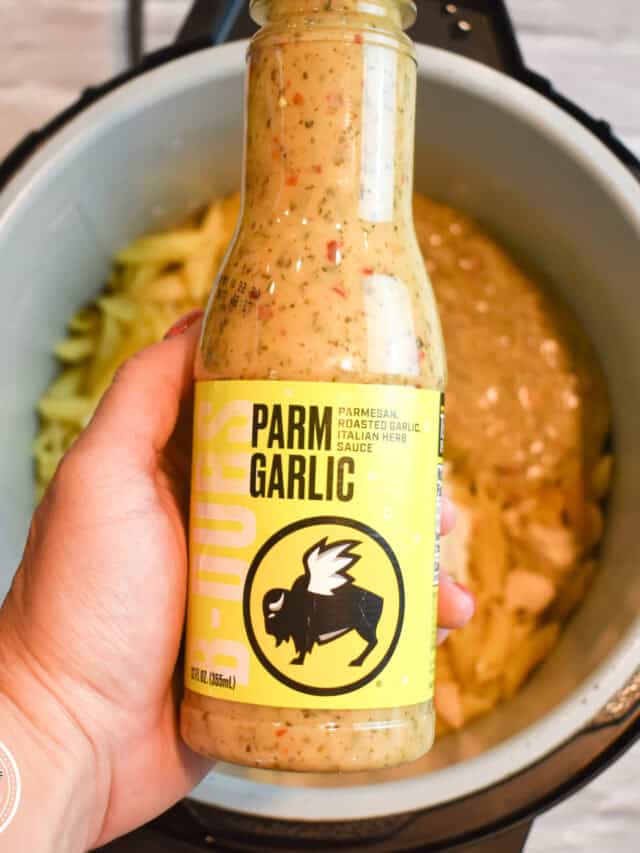 Close up of Instant Pot Parmesan Garlic Chicken Pasta showing the thick creamy garlic parmesan sauce