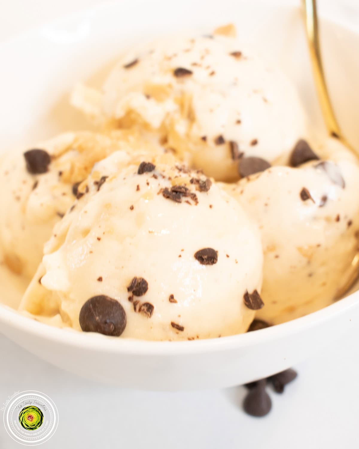 Bowl of Ninja Creami caramel chocolate chip cheesecake protein ice cream topped with chopped chocolate chips
