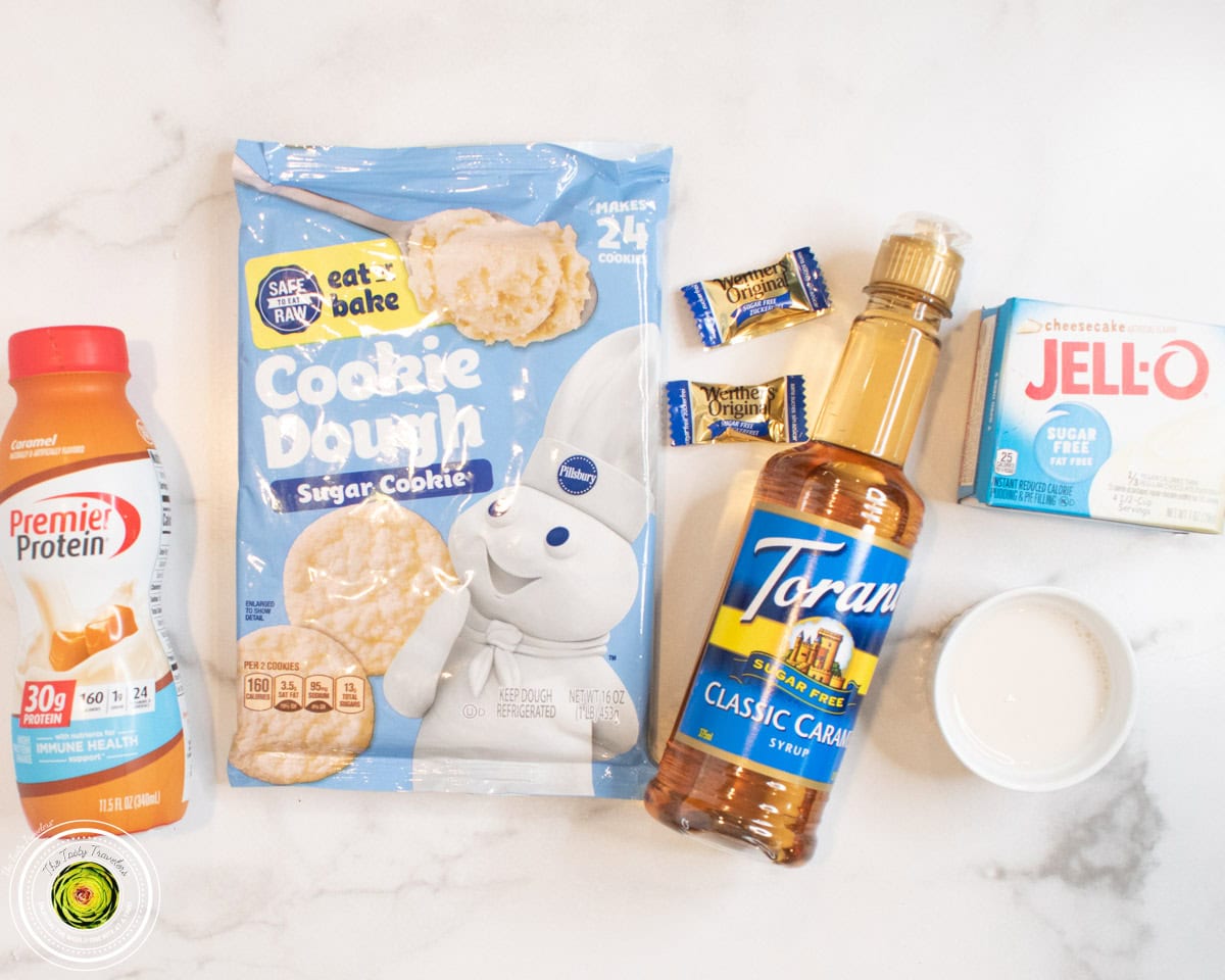 Ingredients for Ninja Creami caramel cookie supreme protein ice cream including caramel protein shake, cheesecake pudding mix, sugar cookie dough, and Werther's candies