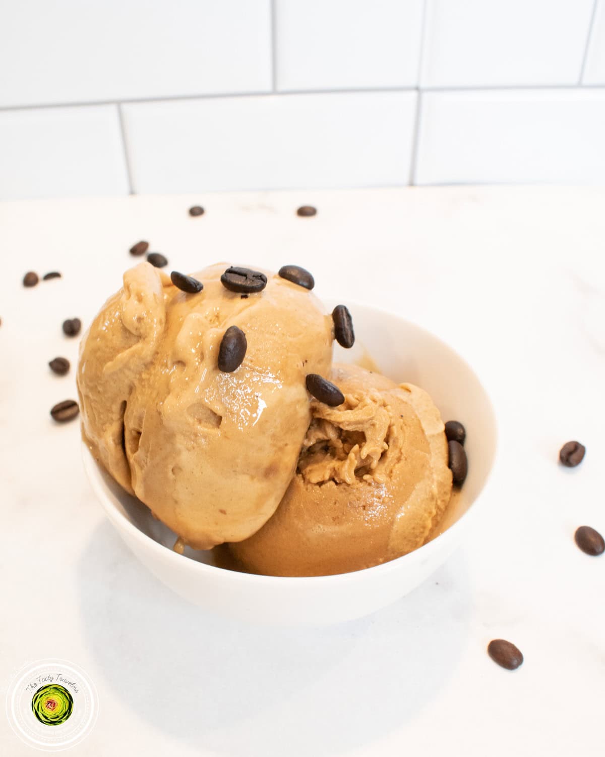 Ninja Creami Coffee Protein Ice Cream scooped into a bowl showing deep coffee-colored ice cream