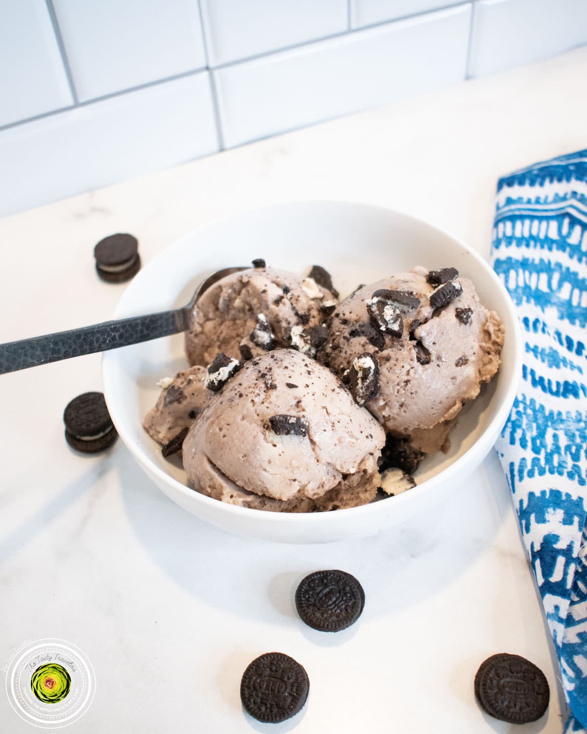 Ninja Creami Cookies and Cream Protein Ice Cream scooped into a bowl with Oreo pieces visible