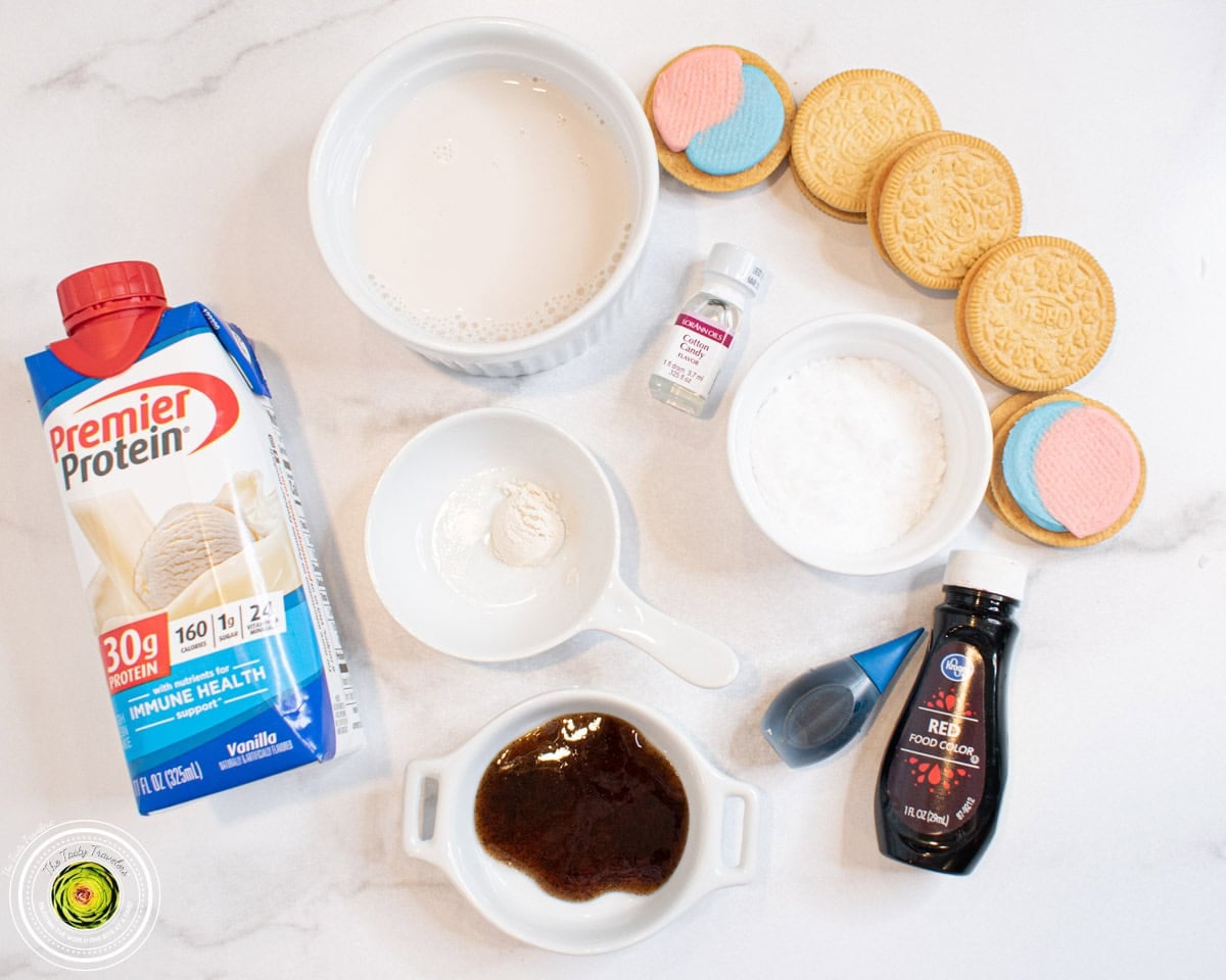 Ingredients for Ninja Creami cotton candy protein ice cream including vanilla protein shake, cotton candy extract, and Cotton Candy Oreos