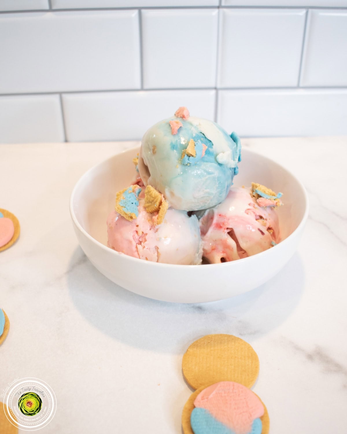Bowl of Ninja Creami cotton candy protein ice cream topped with sprinkles and Oreo pieces