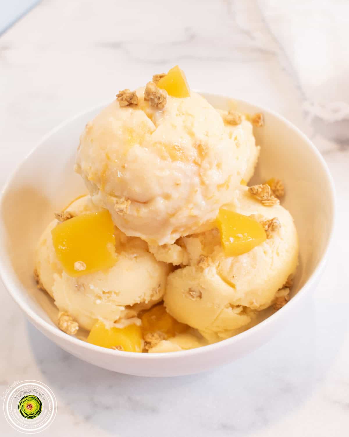 Ninja Creami peach cobbler cottage cheese protein ice cream in a pint container