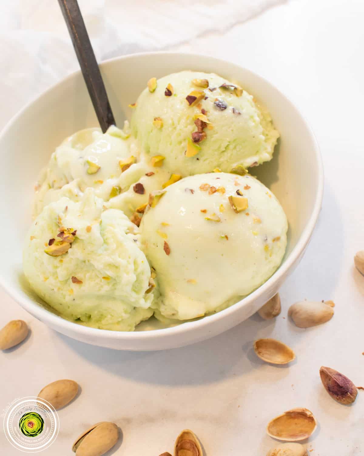 Pistachio Protein Ice Cream in a bowl with a spoon