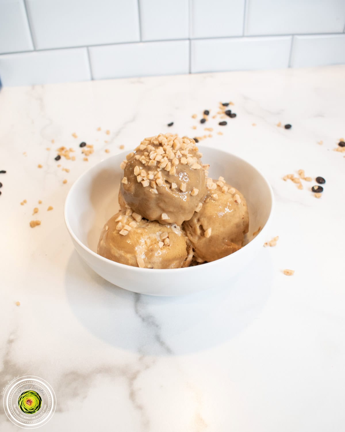 Bowl of Ninja Creami toffee coffee protein ice cream topped with Heath chips