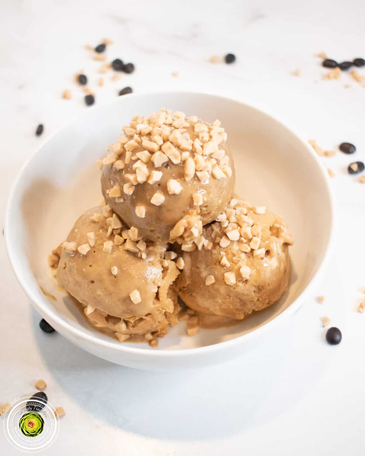 Ninja Creami toffee coffee protein ice cream in a pint container with Heath chip mix-ins on top