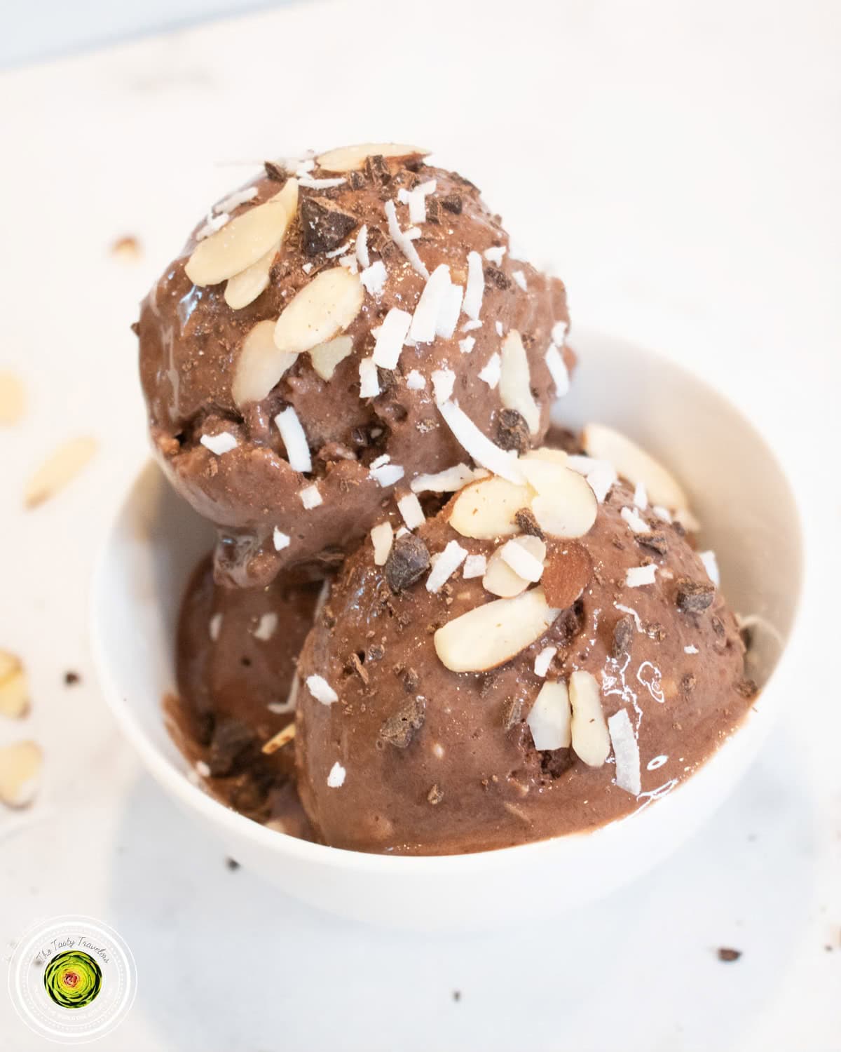 Ninja Creami Almond Joy Protein Ice Cream in pint container showing thick creamy dark chocolate texture