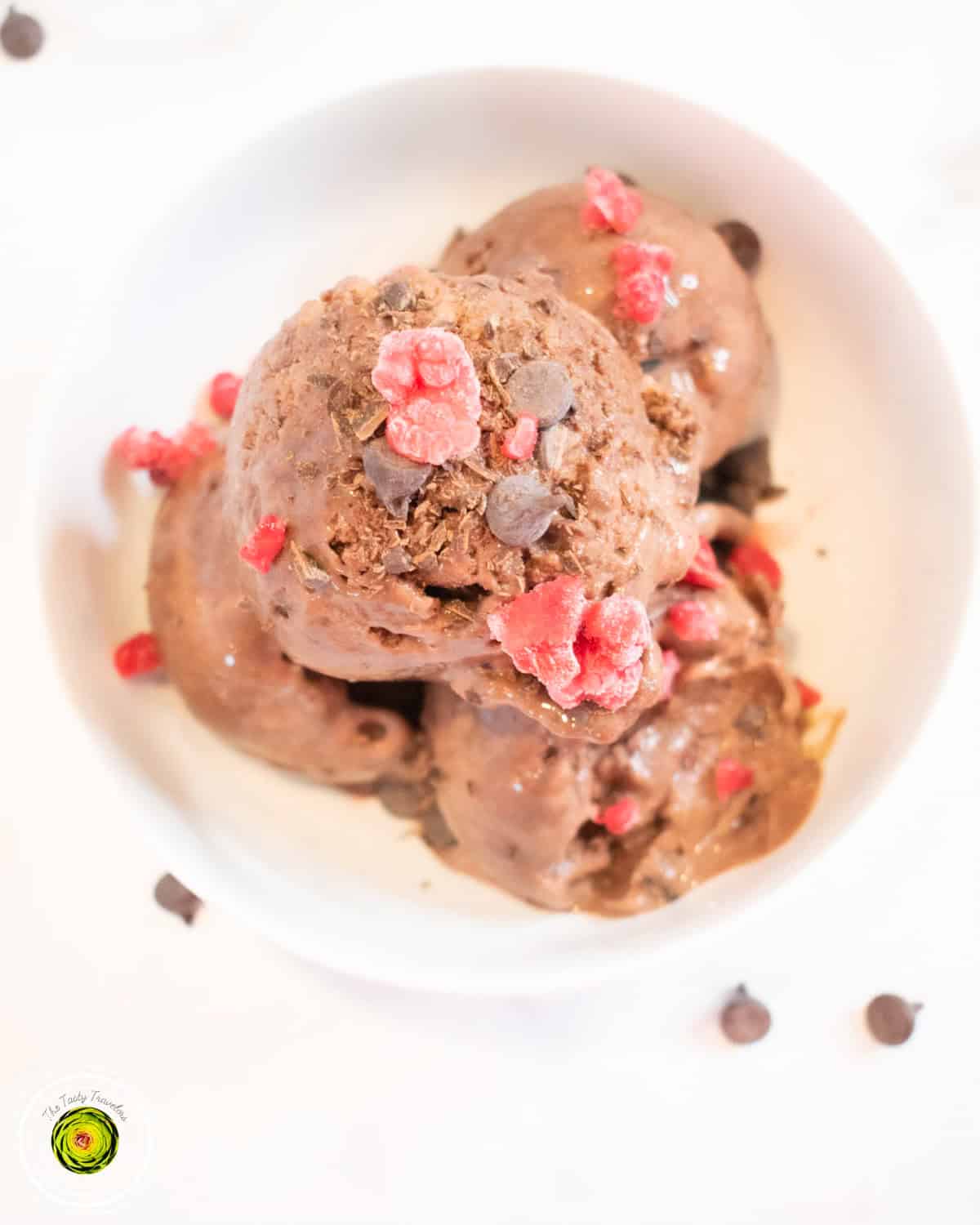 Ninja Creami Raspberry Chocolate Chunk Protein Ice Cream in pint container showing deep reddish-purple color and creamy texture