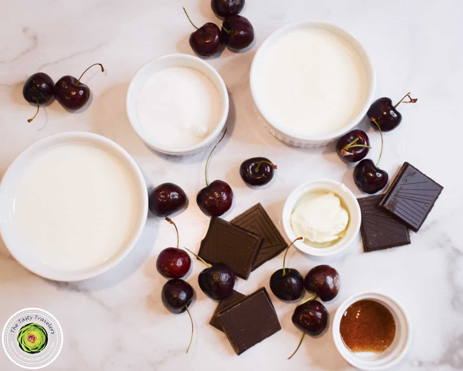 Ingredients for Ninja Creami black cherry chocolate chunk ice cream including whole milk, half and half, cream cheese, fresh cherries, and dark chocolate