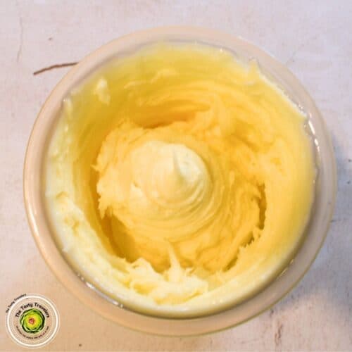 Creamy, smooth butter in a small bowl, ready for cooking or baking. Perfect for enhancing flavors in.