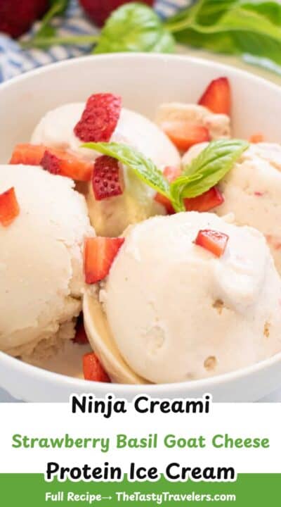 Creamy strawberry basil goat cheese ninja creami ice cream with fresh strawberries and basil garnish.