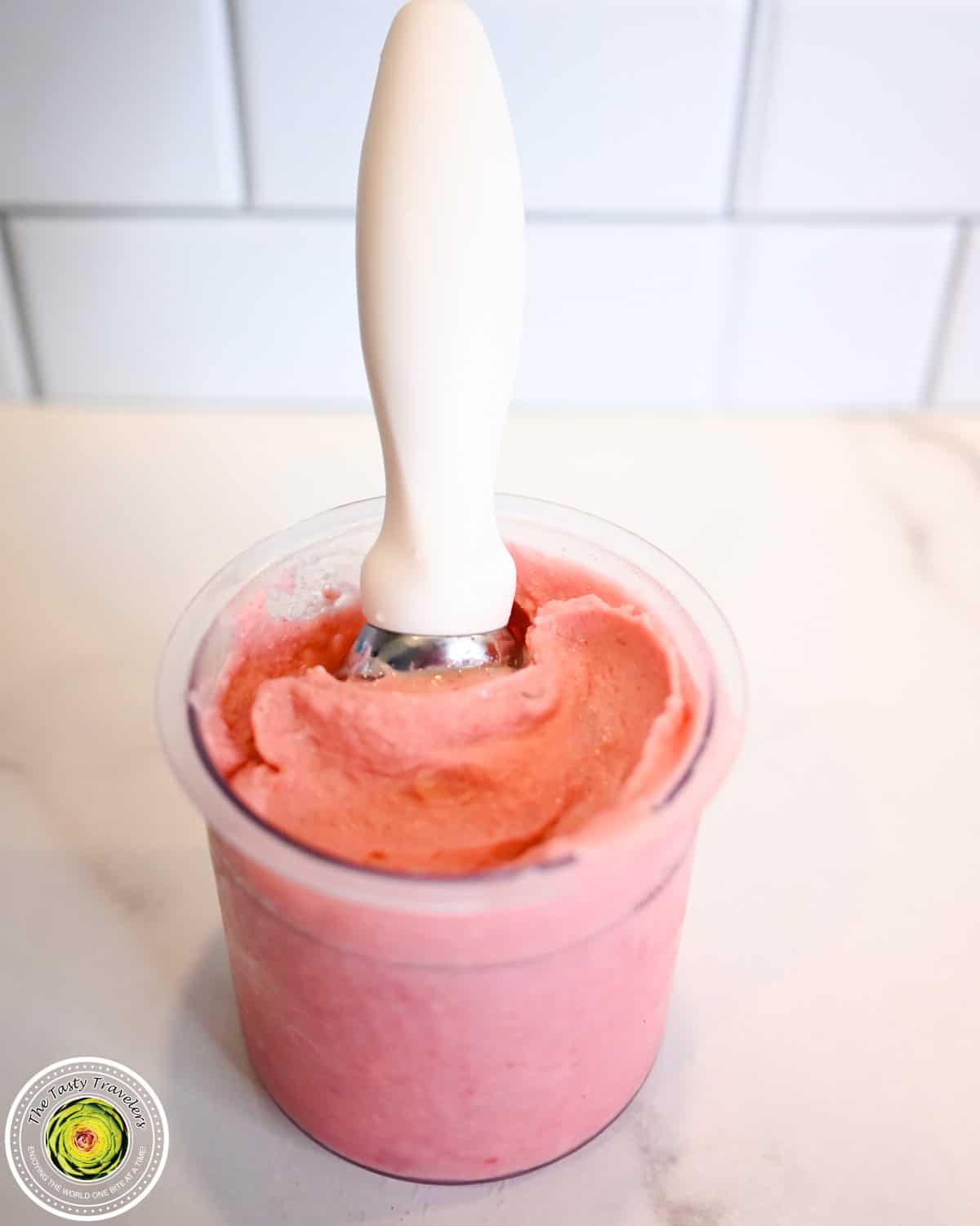 Scooped Ninja Creami low calorie cherry almond ice cream with visible cherry pieces and sliced almonds