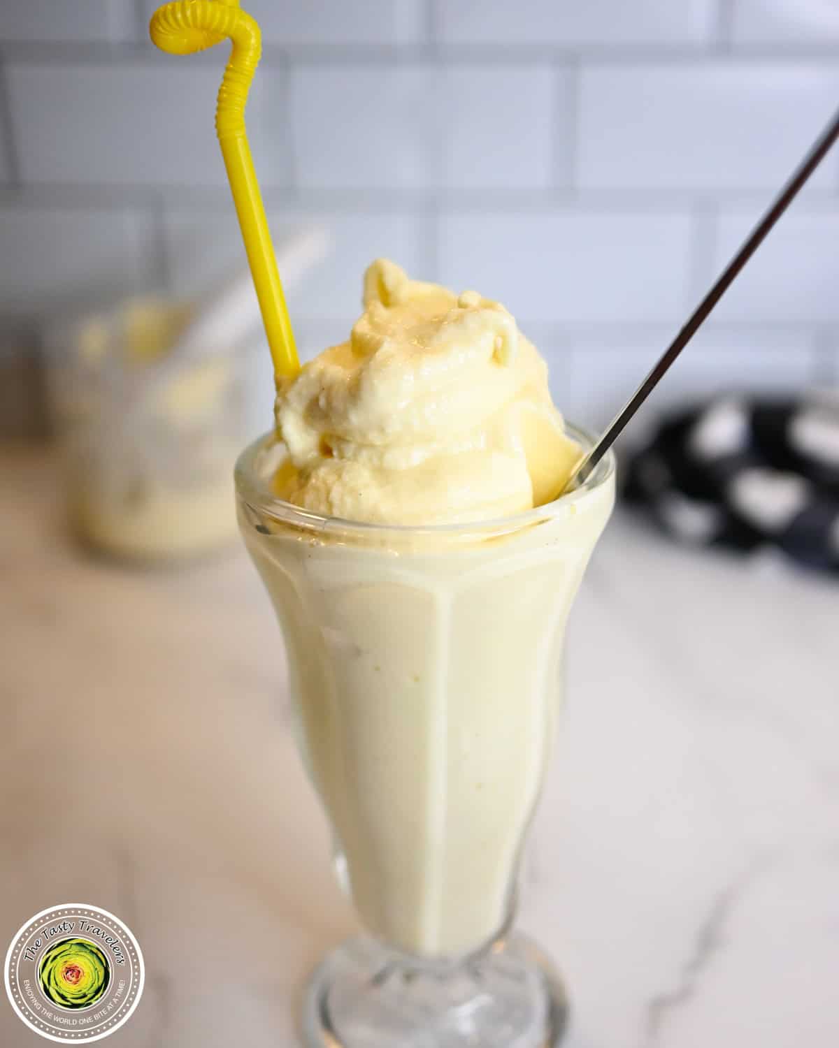 Ninja Creami low calorie frosted lemonade in a glass with a straw
