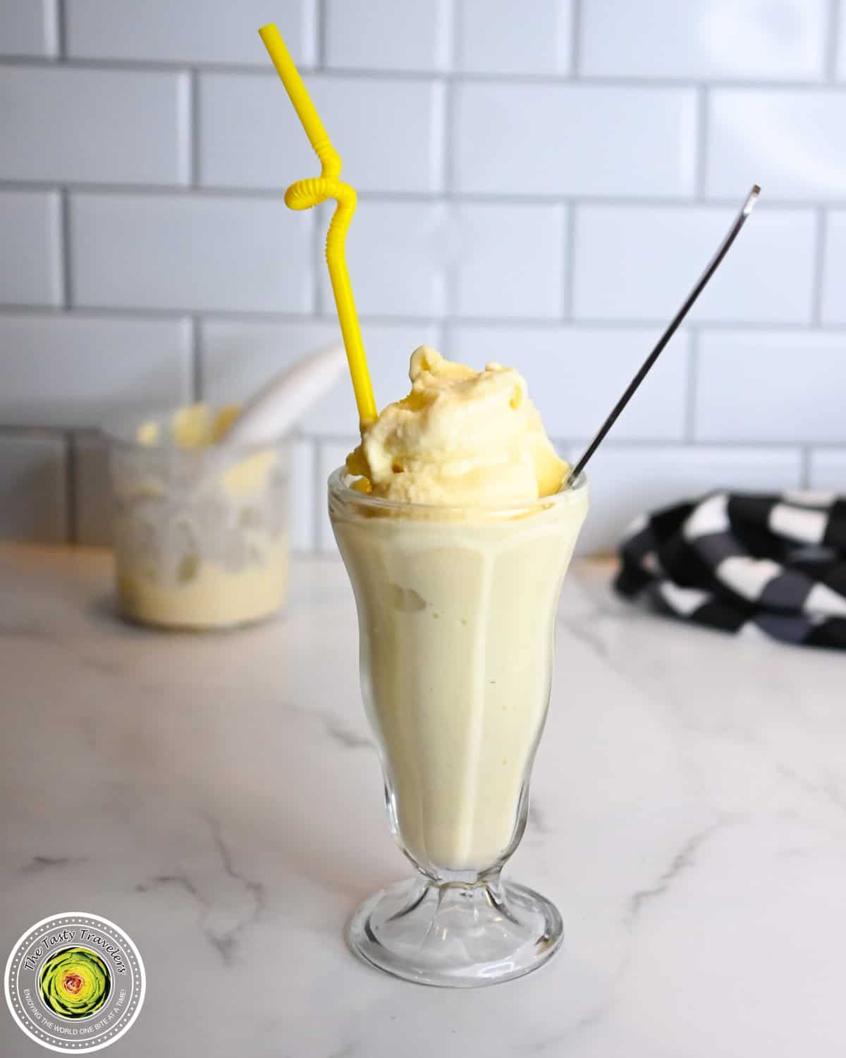 Bowl of Ninja Creami low calorie frosted lemonade with a spoon