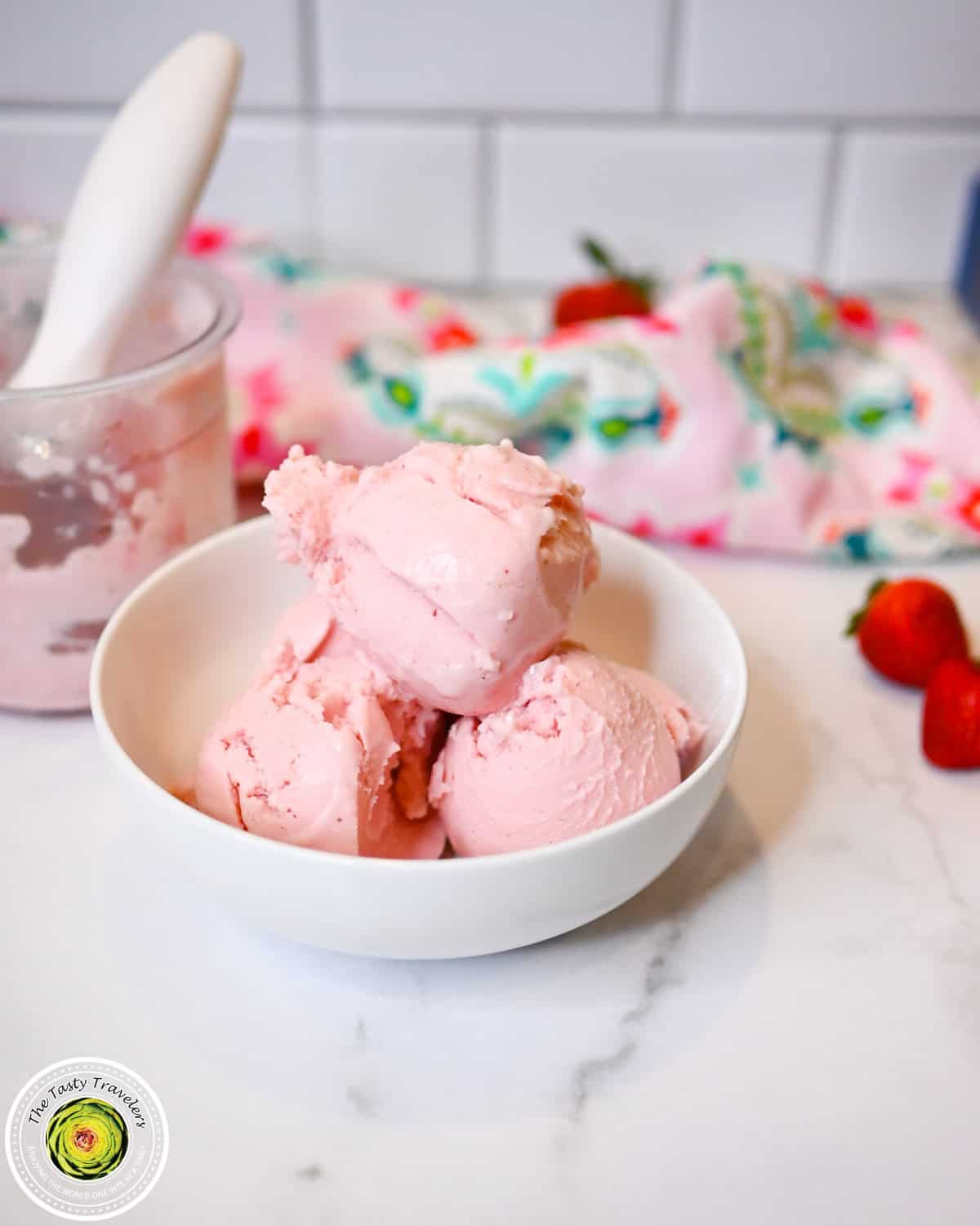Ninja Creami low calorie strawberry ice cream in a bowl topped with fresh strawberries