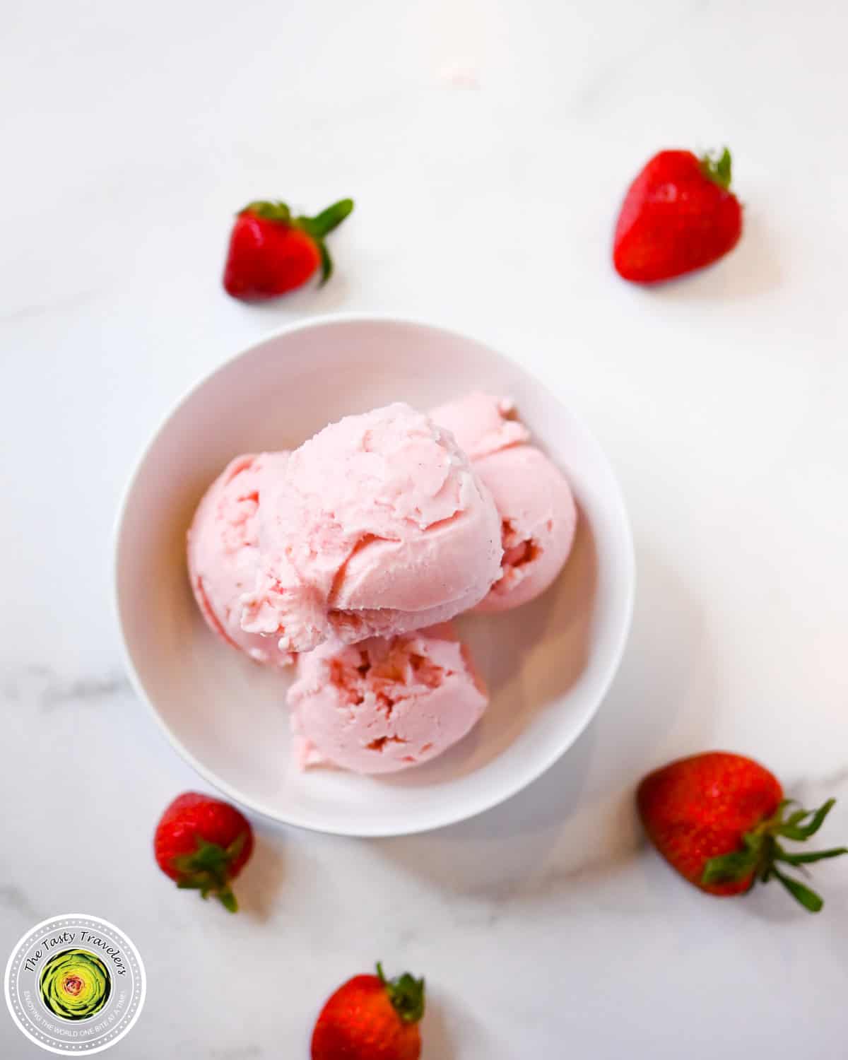 Scooped Ninja Creami low calorie strawberry ice cream showing the creamy pink texture
