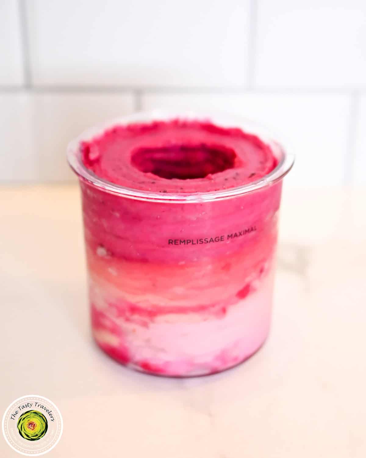 Ninja Creami low calorie tropical triple layered sorbet with yellow, orange, and pink fruit layers