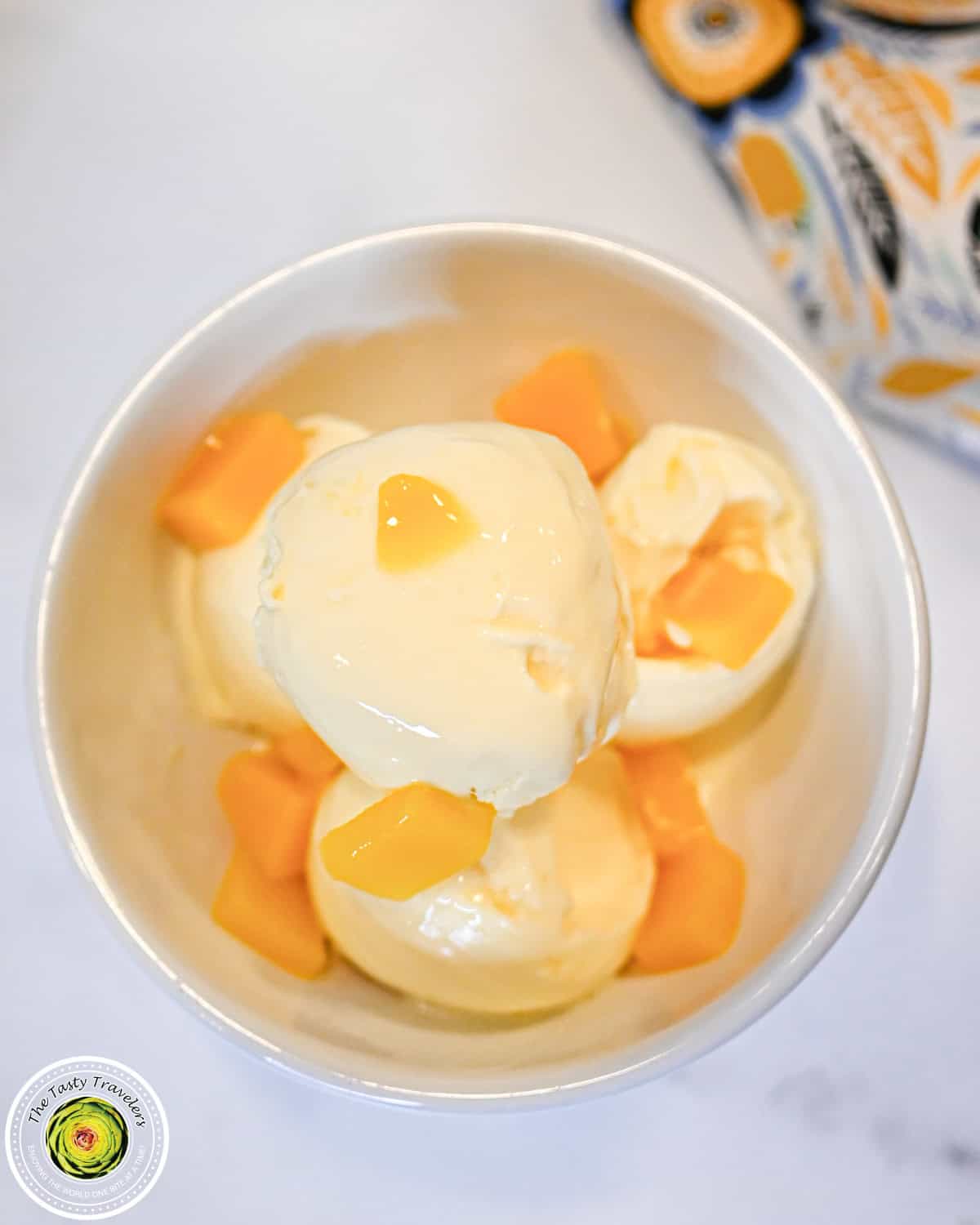 Scooped Ninja Creami low calorie mango cheesecake ice cream showing the smooth creamy texture