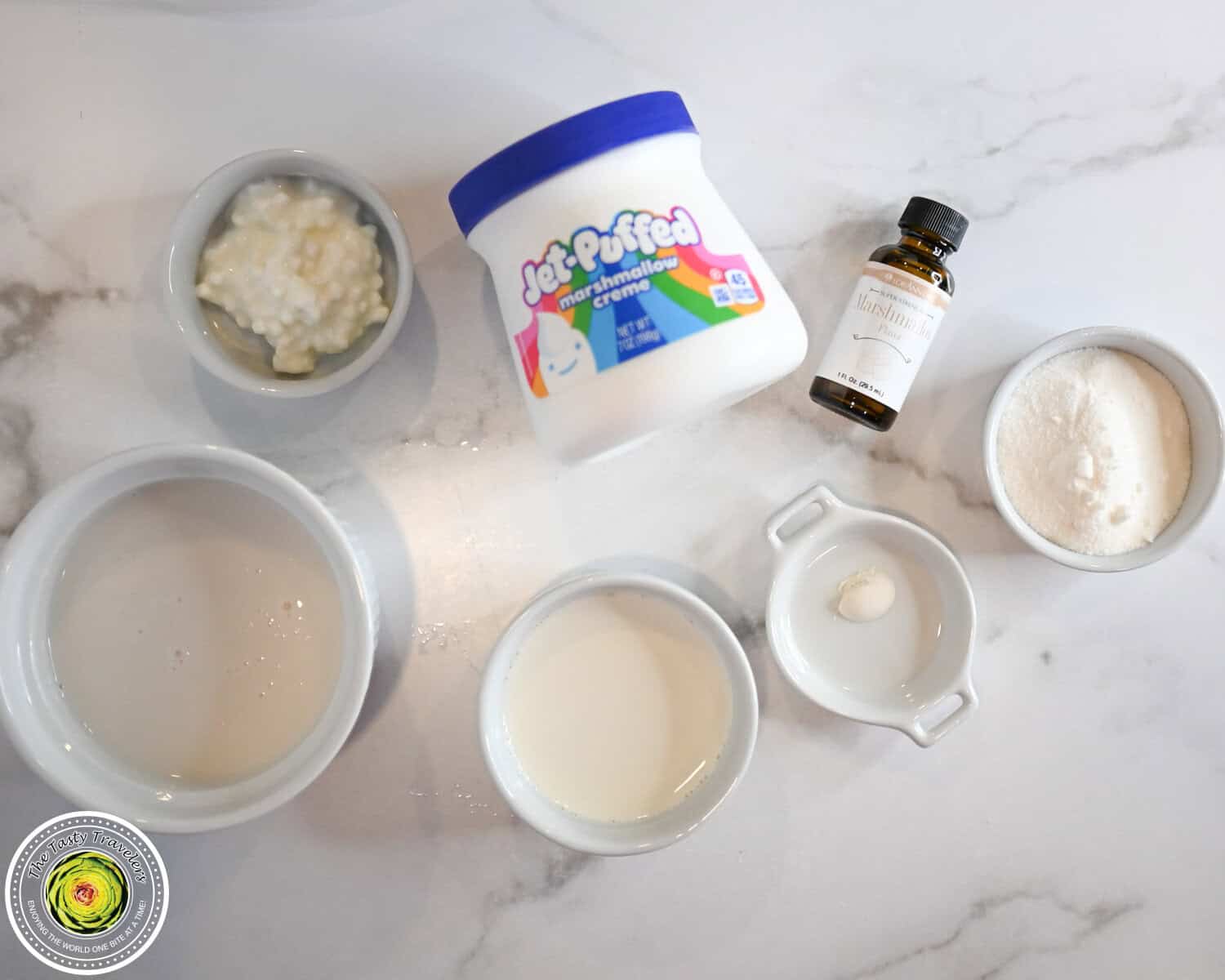Ingredients for Ninja Creami low calorie marshmallow ice cream including unsweetened almond milk, half and half, cottage cheese, allulose, LorAnn marshmallow flavor oil, guar gum, and marshmallow fluff