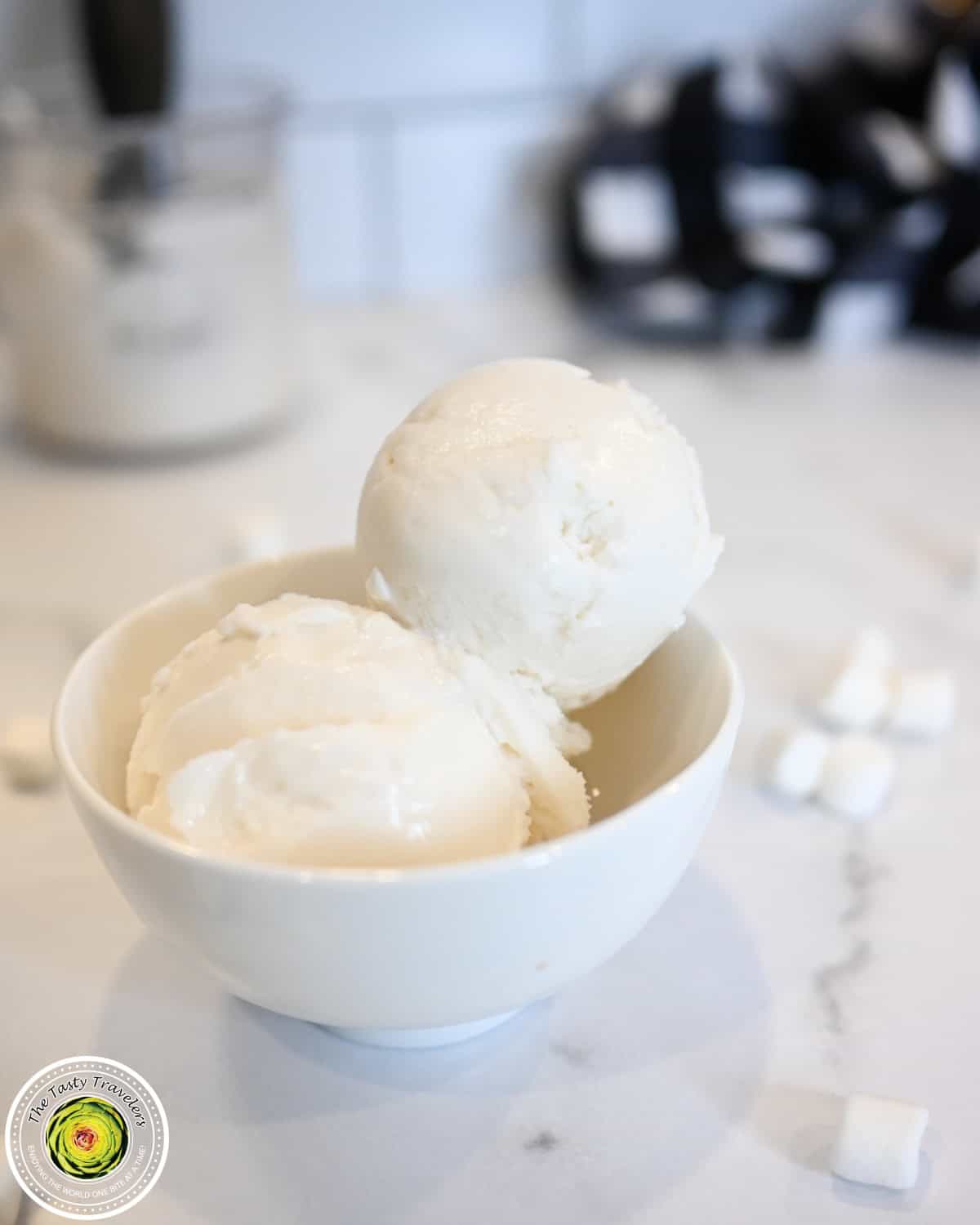 Ninja Creami low calorie marshmallow ice cream in a pint container with marshmallow fluff on top