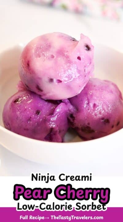 Vibrant purple and pink ninja creami pear cherry sorbet balls in a white bowl.