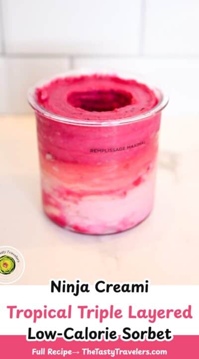 Colorful Ninja Creami tropical layered sorbet in a glass container.