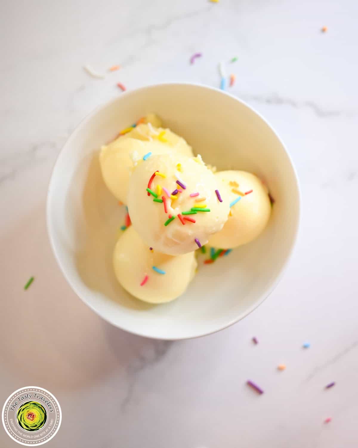 Bowl of Ninja Creami low calorie birthday cake ice cream with a spoon